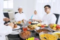Blurred portrait of muslim family eating happily