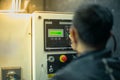 Blurred portrait of technician doing the preventive maintenance in the control room. Workers monitoring the status of electronic Royalty Free Stock Photo