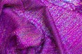 Blurred purple bokeh of satin fabric for background Royalty Free Stock Photo