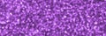 Blurred purple decorative sequins. Background image with shiny bokeh lights from small elements Royalty Free Stock Photo