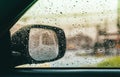 Blurred rain drop on car glass background, water drops at the car window driver side Royalty Free Stock Photo