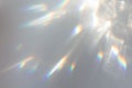 Blurred rainbow light refraction texture on white wall Royalty Free Stock Photo