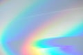 Blurred rainbow light refraction texture on white wall Royalty Free Stock Photo