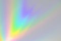 Blurred rainbow light refraction texture on white wall Royalty Free Stock Photo