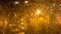 Blurred raindrops on the window glass. The view from the window