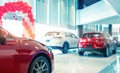 Blurred rear view of red and white luxury SUV car parked in modern showroom for sale. SUV car with sports design in showroom. Car Royalty Free Stock Photo