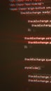 Blurred red-blue distorted code lines displayed on a dark screen, creating a glitchy digital programming aesthetic Royalty Free Stock Photo