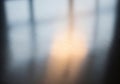 Blurred reflection of light on a smooth, metallic surface, creating a Royalty Free Stock Photo