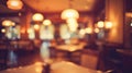 Blurred restaurant scene with tables, chairs, and lights Royalty Free Stock Photo