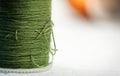 The blurred roll of green thread on background,needlework,craft Royalty Free Stock Photo
