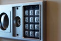 Blurred safe with combination lock in a hotel room, closeup numbers with tilt shift effect. Selective focus Royalty Free Stock Photo
