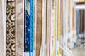 Blurred samples of various colorful rugs in the store are retailing Royalty Free Stock Photo