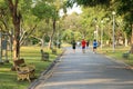 Blurred scene of group of people running in park