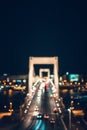 Blurred scene of night time traffic over the Elisabeth bridge. It crosses Danube river and connect Buda and Pest together. Royalty Free Stock Photo