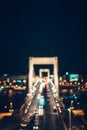 Blurred scene of night time traffic over the Elisabeth bridge. It crosses Danube river and connect Buda and Pest together. Royalty Free Stock Photo