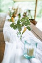 Blurred, selected focus photo of rustic wedding table. Vintage wooden dining table with decorations, flowers and candles Royalty Free Stock Photo