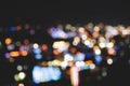 Blurred shot of city buildings with lit lights at night time Royalty Free Stock Photo