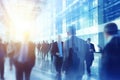 Blurred silhouettes of businessmen walking in an office glass building. Business world