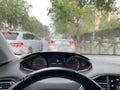Blurred silhouettes of cars in a congestion of vehicles on a rainy day. Traffic congestion