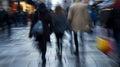 Blurred silhouettes of individuals rushing through busy sidewalks showcasing the frenetic pace and constant motion of Royalty Free Stock Photo