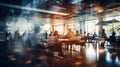Blurred silhouettes of people in a coworking space or glassed office