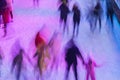 Blurred skating rink with people in evening time outdoors in the park on winter. Sport and leisure concept - skating on Royalty Free Stock Photo