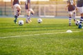 Blurred Soccer Field at School. Young Soccer Players Training on Pitch