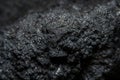 Dark background with the texture of a piece of coal Royalty Free Stock Photo