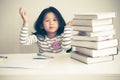 Blurred soft image of A 6 year old Asian girl, Are falling asleep While doing homework Royalty Free Stock Photo