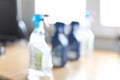 Blurred spray bottle of disinfectant household cleaners. Royalty Free Stock Photo