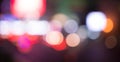 Blurred street lights, urban abstract background. defocused image of night city. Vehicles on the road. Royalty Free Stock Photo