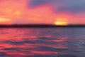 Blurred sunset sky background. Defocused dramatic gold sunset sky clouds over the sea. Blur clear sea water texture. Bokeh light Royalty Free Stock Photo