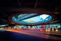 Blurred Tail Lights And Traffic Light on the cityscape