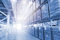 Blurred Tall Shelveas Warehouse Storage for Industrial or Logistics Background. Warehouse Space an Light Background. Factory Royalty Free Stock Photo