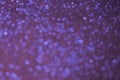 Blurred texture purple background with blue sparkles