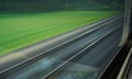 A blurred texture of the railway through the train window