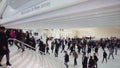 Blurred of top view people walking on white floor or large crownd of anomymous moving in transportation hub in modern hall center