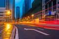 Blurred traffic light trails on road at night