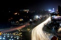 Blurred traffic light trails on road at night in Pakistan