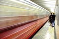 Blurred train car and silhouettes of people without faces on the subway platform Royalty Free Stock Photo