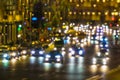 Blurred urban abstract city street, lights at night. Traffic. Reflection car headlights on wet road after rain Royalty Free Stock Photo