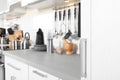 Blurred view of different appliances, clean dishes and utensils Royalty Free Stock Photo