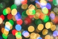 Blurred view of glowing Christmas lights as background. Royalty Free Stock Photo