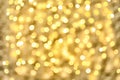 Blurred view of golden Christmas lights as background. Royalty Free Stock Photo