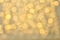 Blurred view of golden Christmas lights as background. Royalty Free Stock Photo