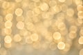 Blurred view of golden Christmas lights as background. Royalty Free Stock Photo