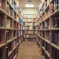 Blurred view of a library aisle with shelves on both sides filled with books of various Royalty Free Stock Photo