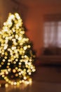 Blurred view of living room interior with decorated Christmas tree Royalty Free Stock Photo