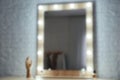 Blurred view of makeup mirror on table Royalty Free Stock Photo