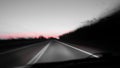Blurred view on the road at dawn